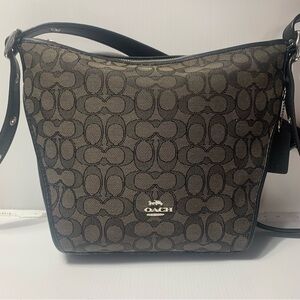 Coach Black and grey signature Crossbody Bag NWOT. Not sure when the c got lost
